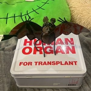 Metal work and rock bat sculpture